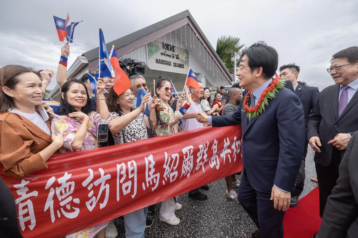 Taiwan President Lai Ching-te being greeted by members of the public at the international airport in Majuro, Marshall Islands, on Dec 3.