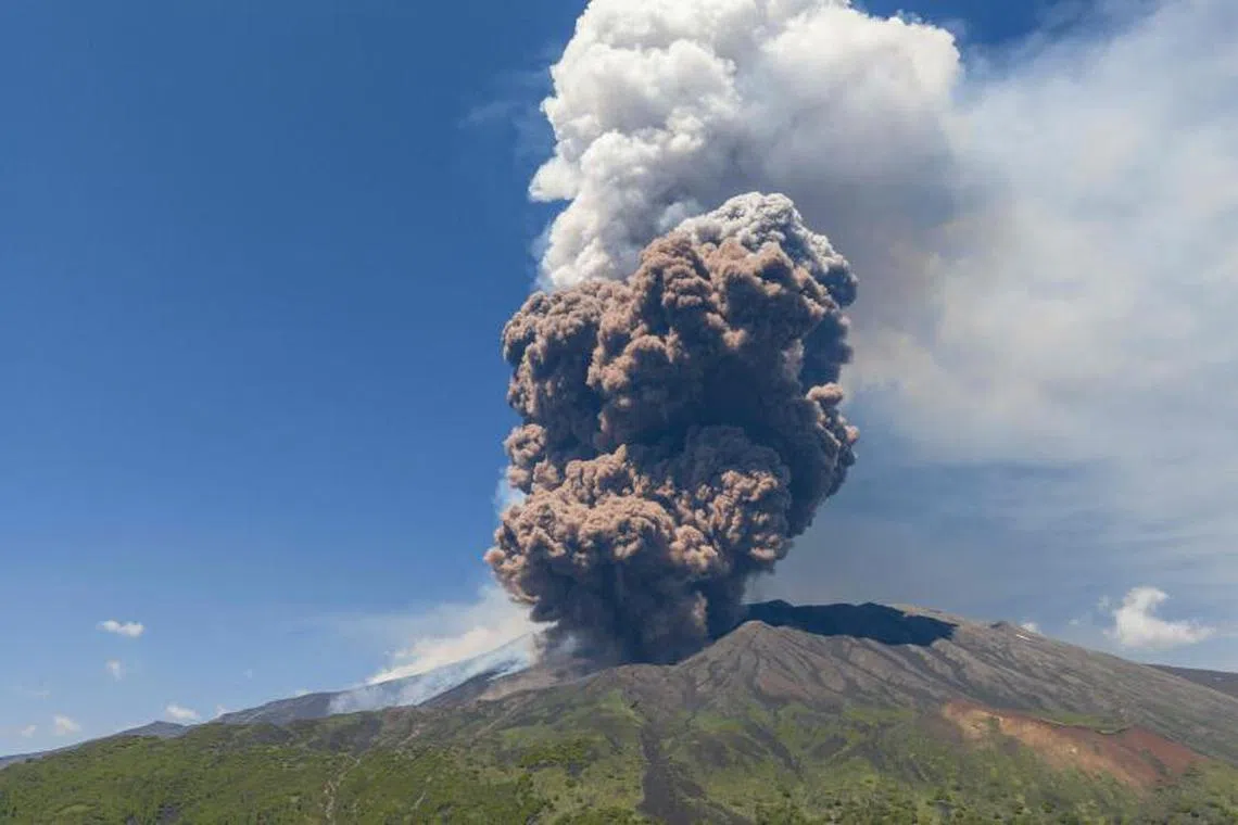 Smoke rises from the crater of the Etna volcano as it erupts, on Mount Etna near Catania on June 2, 2025. A huge plume of ash, gas and rock spewed forth on June 2, 2025, from Italy's Mount Etna, Europe's largest active volcano, after a portion of its southeastern crater likely collapsed, authorities said. (Photo by Giuseppe Distefano / AFP)