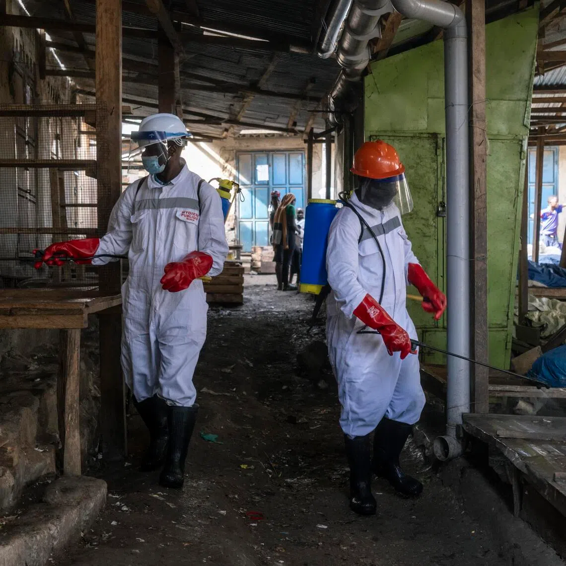 Health workers disinfecting a public market in Bunia, as part of the response to the Ebola outbreak in the Democratic Republic of Congo on May 23.