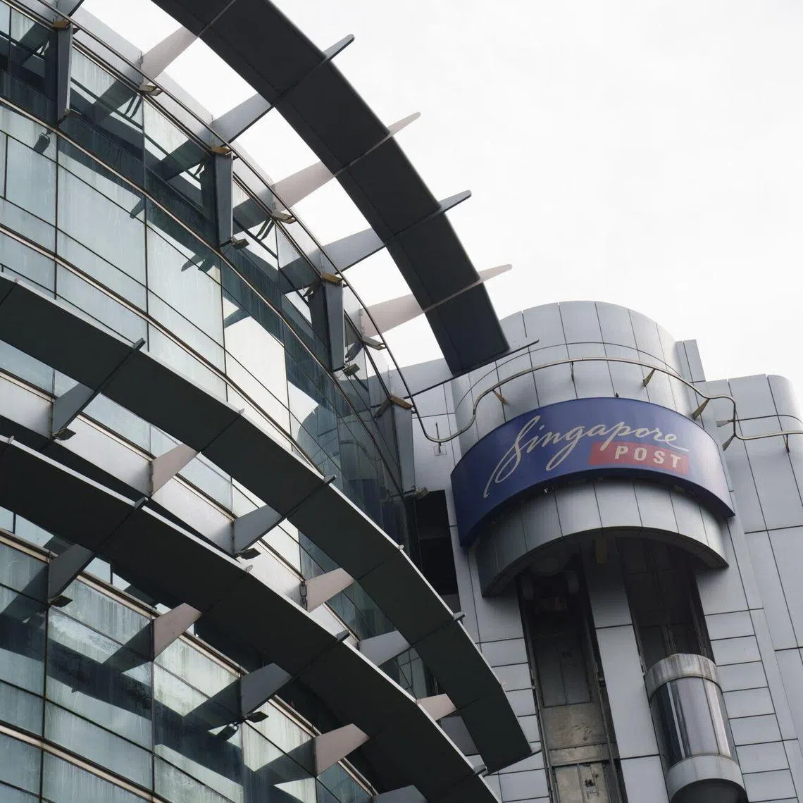 Signage for Singapore Post Ltd. atop the Singpost Center in Singapore, on Tuesday, Dec. 24, 2024. Singapore Post fired its chief executive officer and a number of other senior executives following allegations related to its international e-commerce logistics parcels business. Photographer: Ore Huiying/Bloomberg