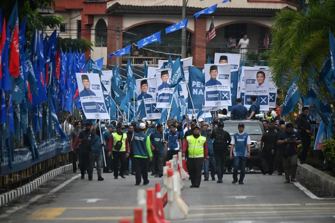 Perikatan Nasional supporters walking towards the nomination centre in Gombak on 5 November 2022.