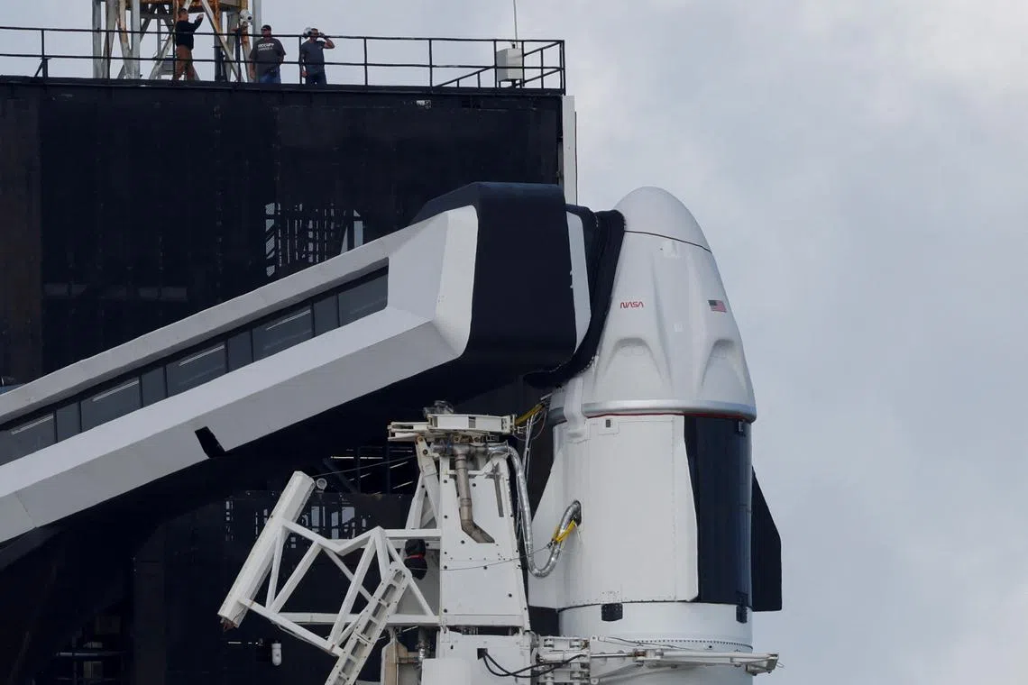 FILE PHOTO: A SpaceX Falcon 9 rocket with the Crew Dragon capsule stands on Pad-39A in preparation for a mission to carry four crew members to the International Space Station from NASA's Kennedy Space Center, in Cape Canaveral, Florida, U.S. October 4, 2022. REUTERS/Joe Skipper/File photo