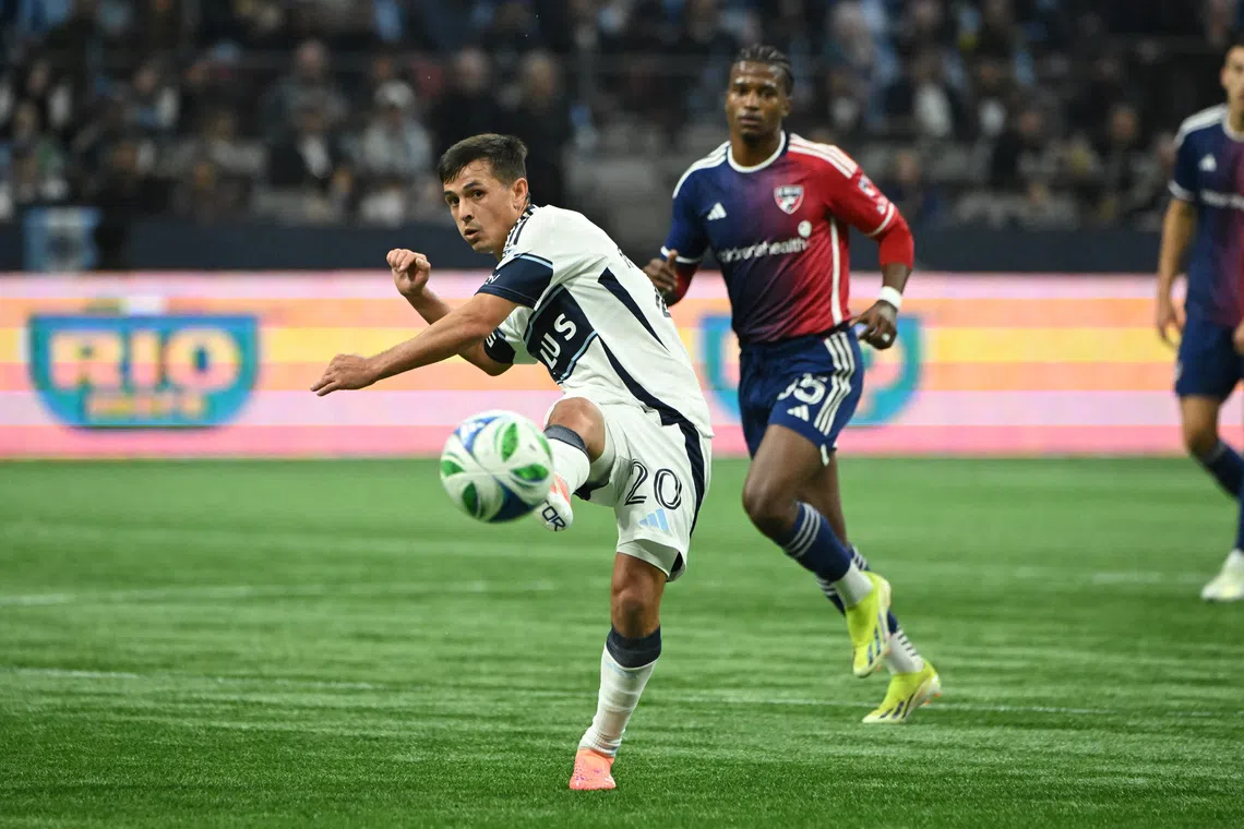 FILE PHOTO: Oct 26, 2025; Vancouver, British Columbia, CAN; Vancouver Whitecaps FC midfielder Andres Cubas (20) passes the ball during the first half against FC Dallas at BC Place. Mandatory Credit: Simon Fearn-Imagn Images/File Photo