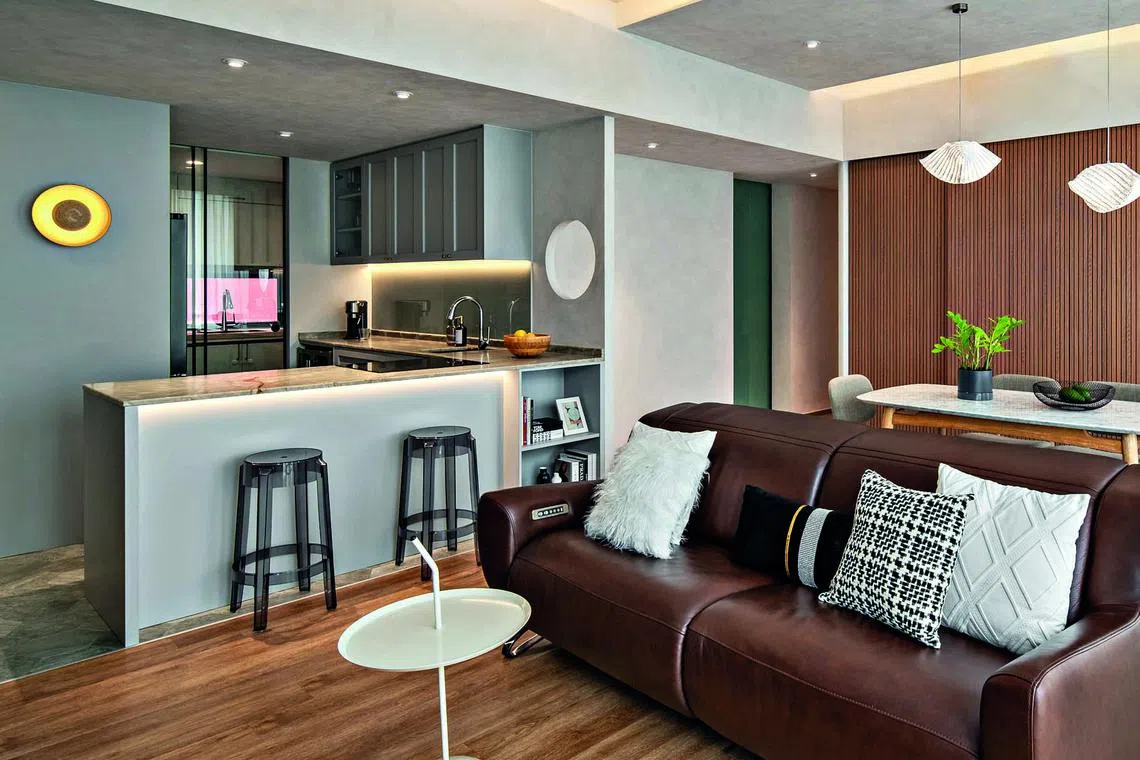 A sofa from Kelvin Giormani complements the light timber tones.