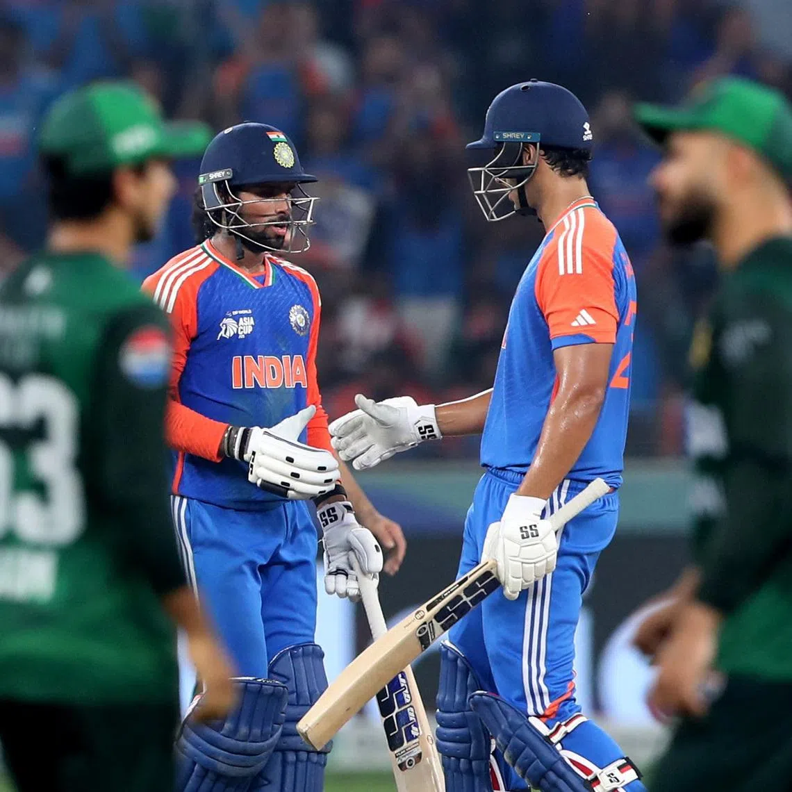 FILE PHOTO: Cricket - Asia Cup - Final - India v Pakistan - Dubai International Cricket Stadium, Dubai, United Arab Emirates - September 28, 2025 India's Tilak Varma celebrates after reaching his half century with Shivam Dube REUTERS/Satish Kumar/File photo