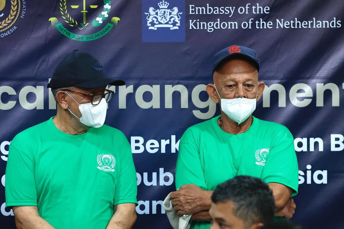 Dutch life-sentenced prisoner Ali Tokman (left) and death row convict Siegfried Mets (right) attend a handover ceremony for their repatriation at Cipinang Prison in Jakarta on Dec 8.