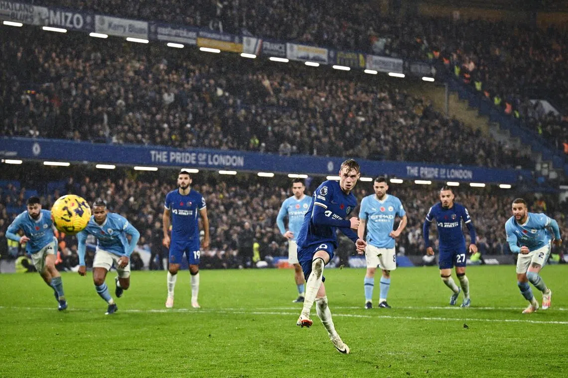 Chelsea's Cole Palmer making it 4-4 from the penalty spot  in their pulsating match against Manchester City.