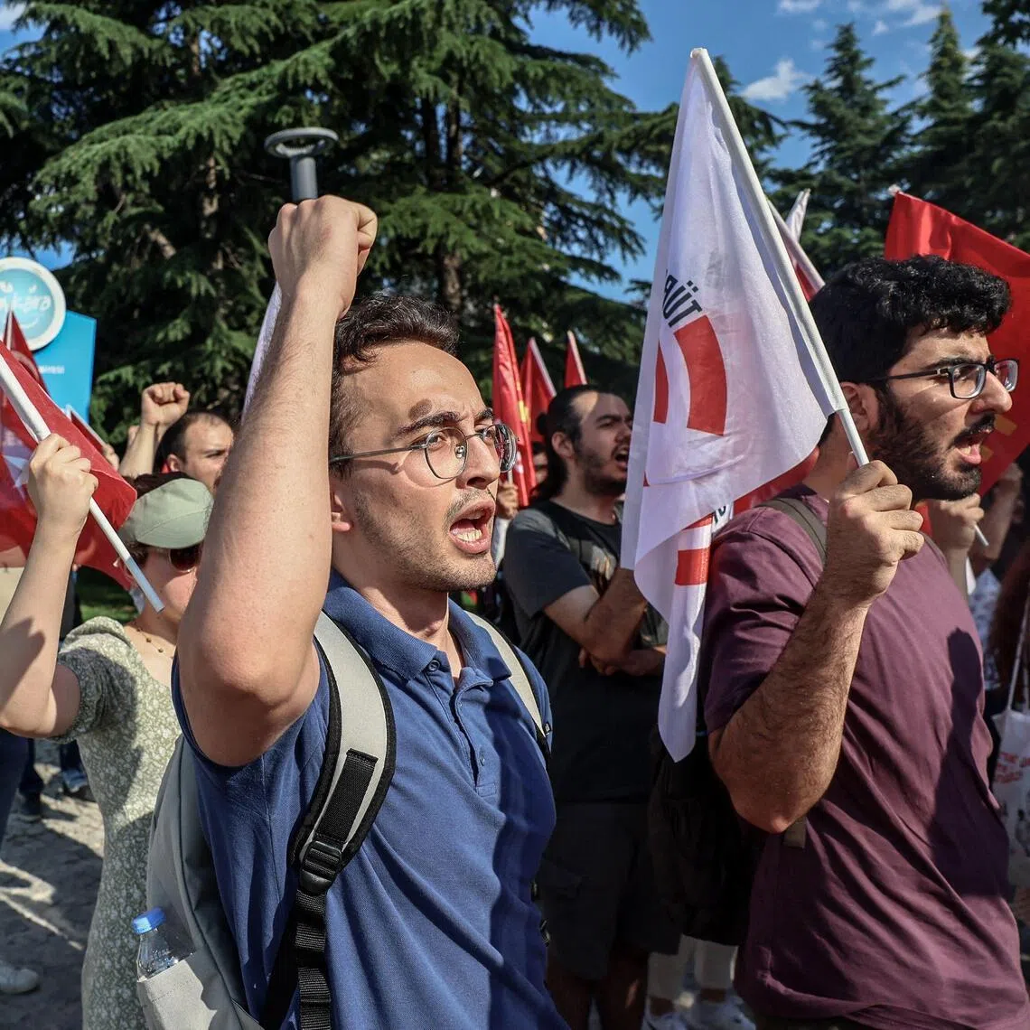 Demonstrators chant slogans during a protest against preparations and park closures for the upcoming NATO Summit in early July in Ankara, on June 25.