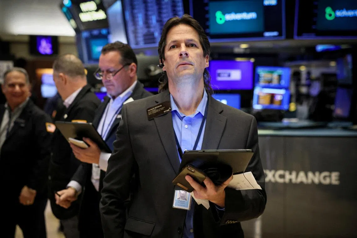 Traders work on the floor of the New York Stock Exchange, in New York City.