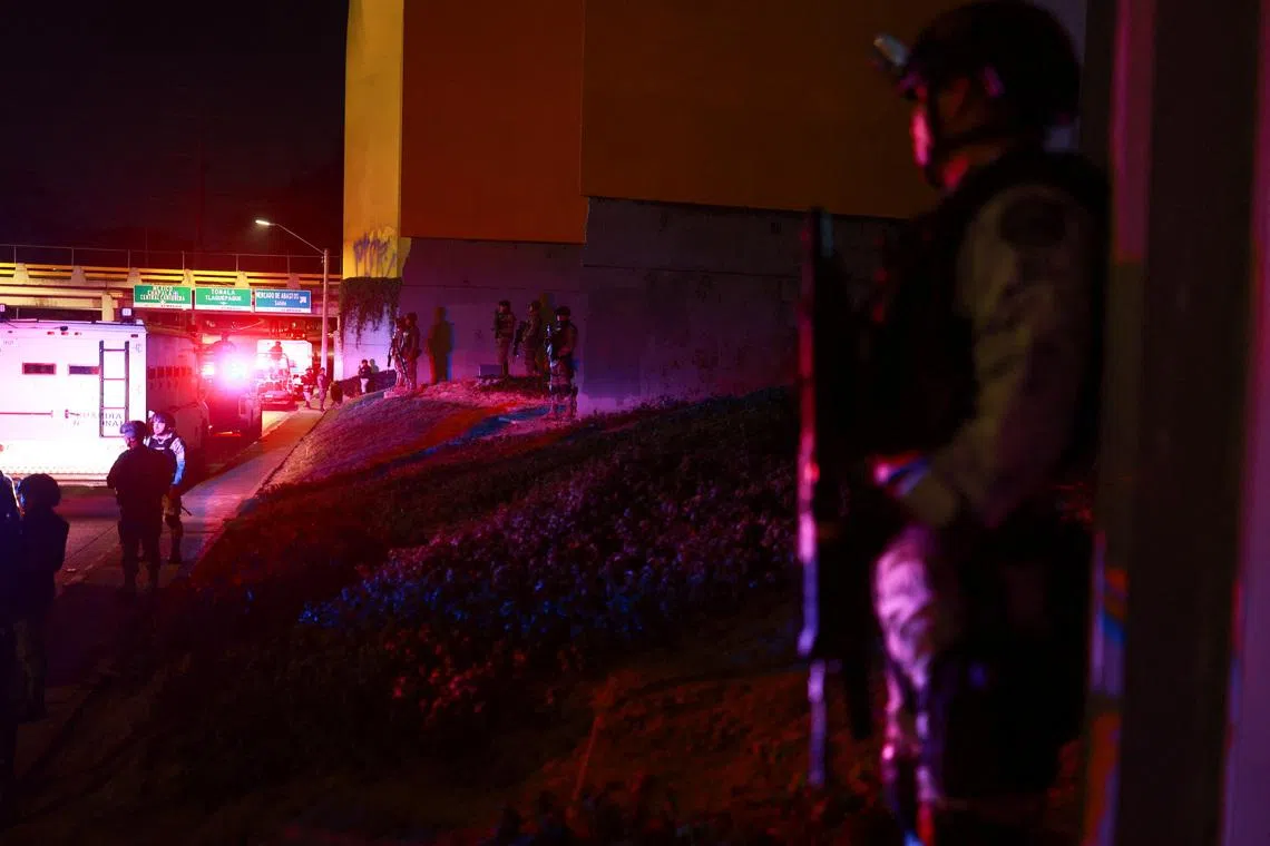 Members of the Mexican army and the National Guard stand guard at a roundabout on a main avenue, following a military operation in which Mexican officials said cartel boss Nemesio Oseguera, \"El Mencho,\" was killed in Jalisco state, in Guadalajara, Mexico, February 23, 2026. REUTERS/Jose Luis Gonzalez