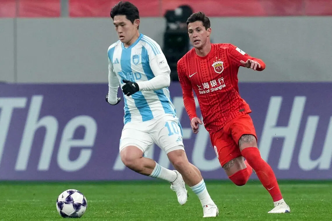 Shanghai Port midfielder Mateus Vital closing down Ulsan HD midfielder Lee Dong-gyeong in their AFC Champions League football match in Shanghai on Feb 18, 2026.