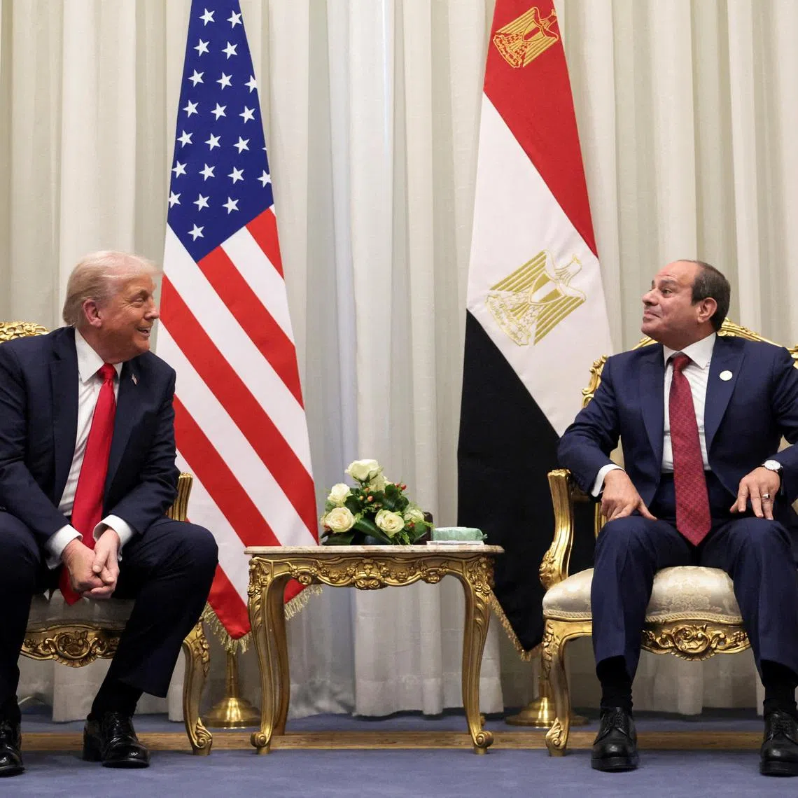 U.S. President Donald Trump and Egyptian President Abdel Fattah el-Sisi meet ahead of a world leaders' summit on ending the Gaza war, amid a U.S.-brokered prisoner-hostage swap and ceasefire deal between Israel and Hamas, in Sharm El-Sheikh, Egypt, October 13, 2025. REUTERS/Evelyn Hockstein