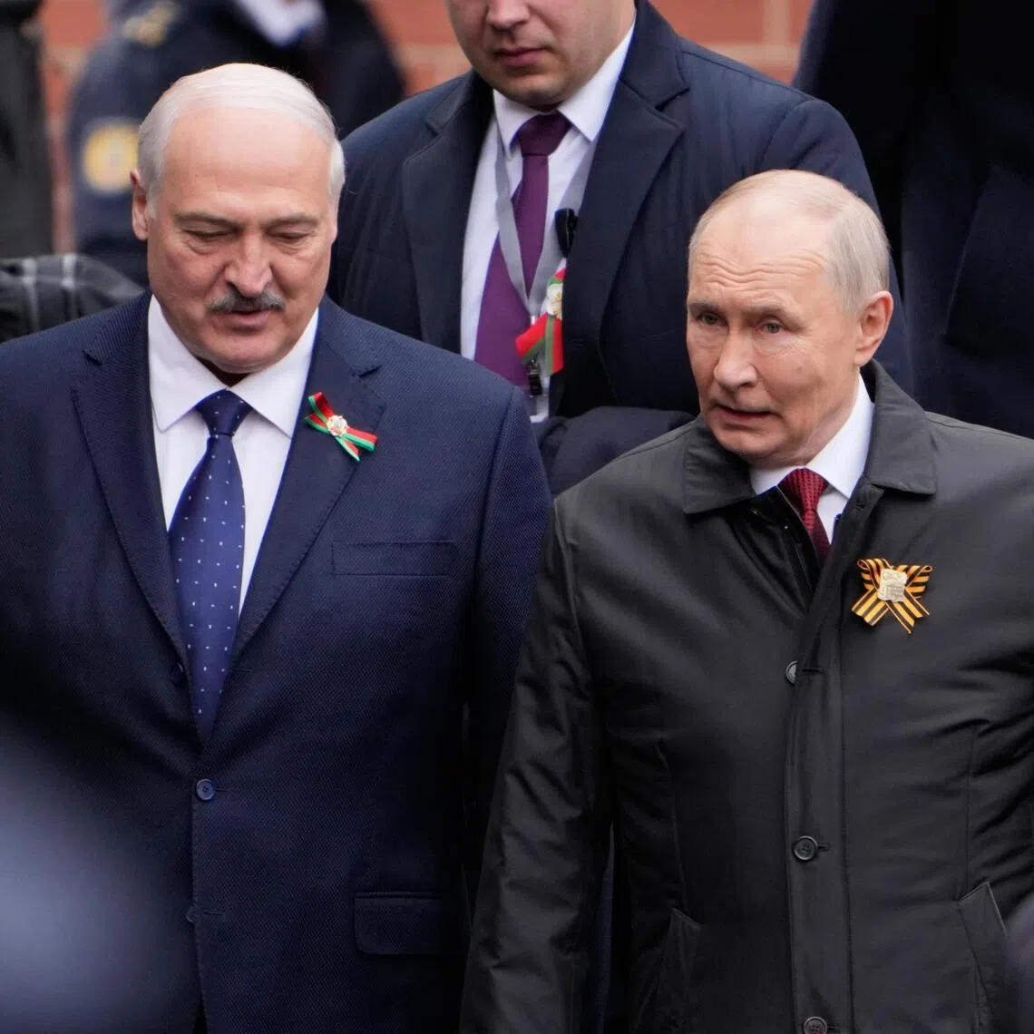 Belarusian President Alexander Lukashenko (left) attending Russia's Victory Day military parade on May 9, with Russian President Vladimir Putin.