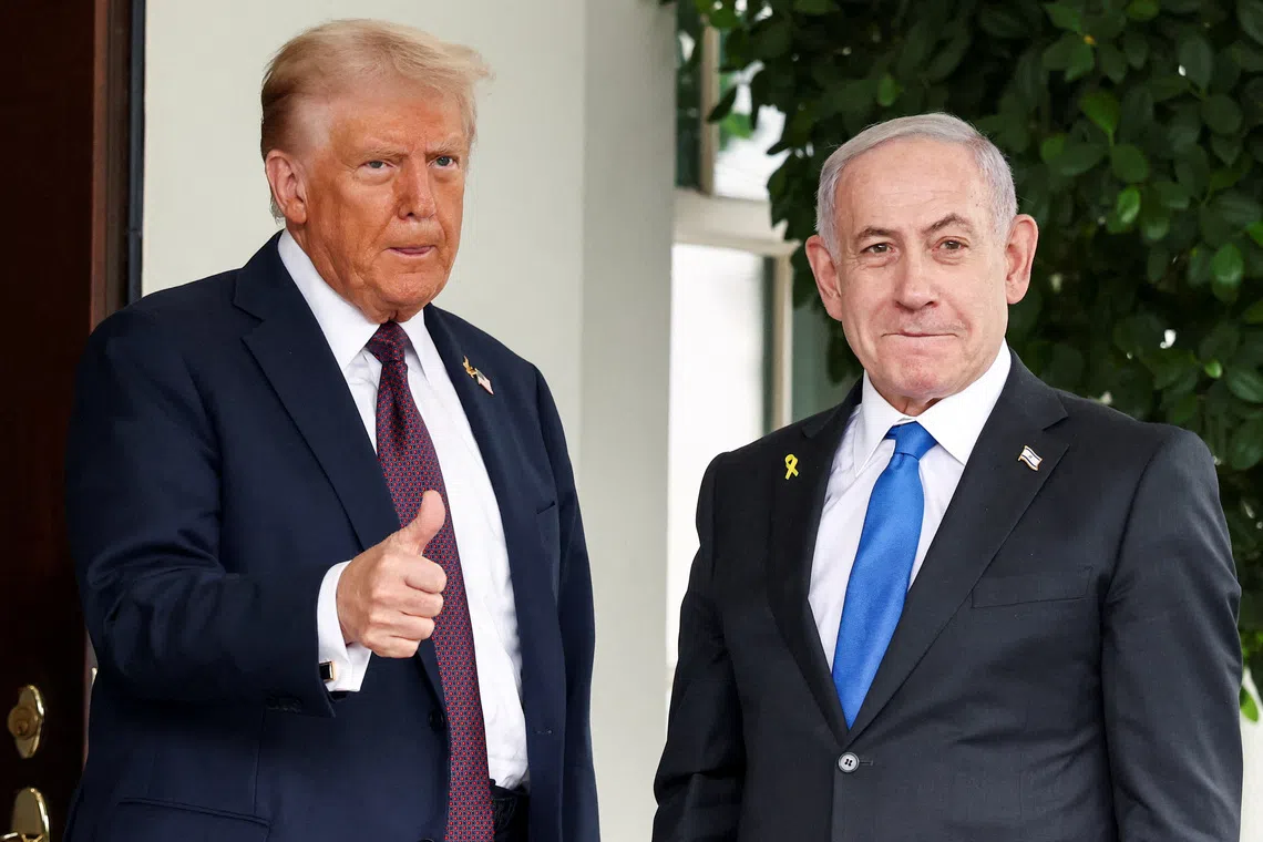 FILE PHOTO: U.S. President Donald Trump gives a thumbs up as he welcomes Israeli Prime Minister Benjamin Netanyahu at the White House in Washington, D.C., U.S., September 29, 2025. REUTERS/Kevin Lamarque/File Photo