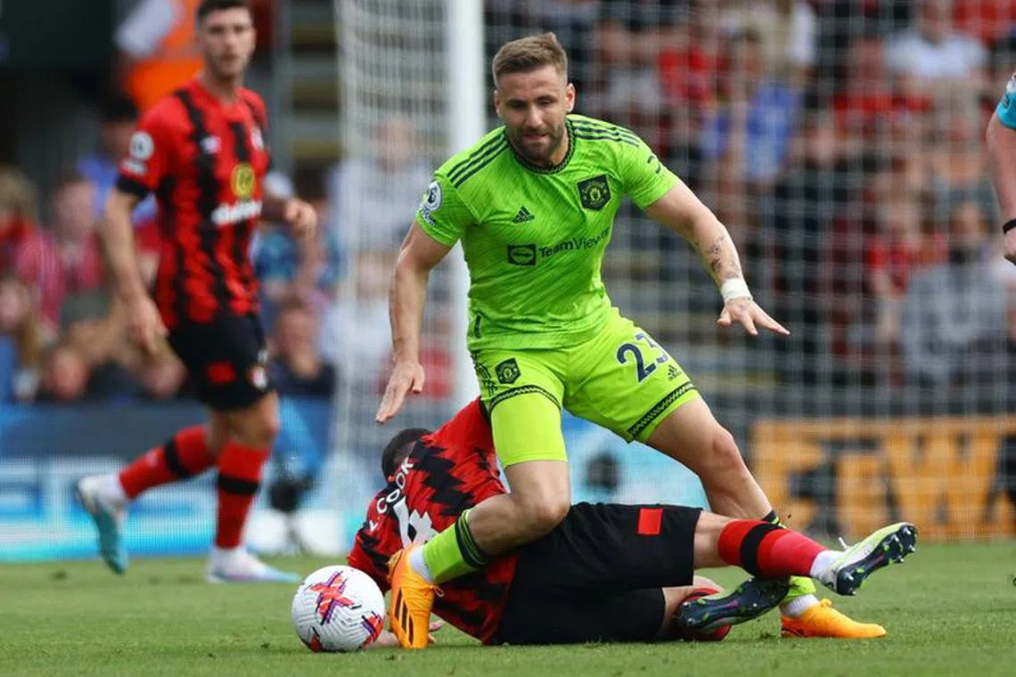 FILE PHOTO: Soccer Football - Premier League - AFC Bournemouth v Manchester United - Vitality Stadium, Bournemouth, Britain - May 20, 2023 Manchester United's Luke Shaw in action with AFC Bournemouth's Lewis Cook Action Images via Reuters/Matthew Childs/File photo