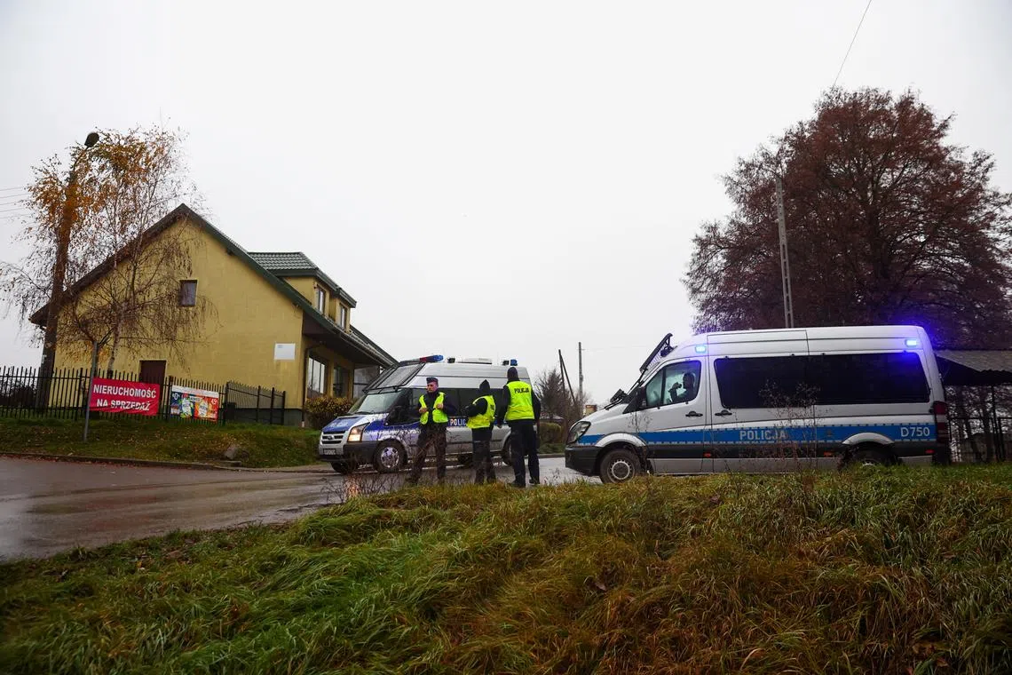 Police officers standing at a blockade after an explosion in Przewodow, a village in eastern Poland near the border with Ukraine, on Nov 16, 2022. 