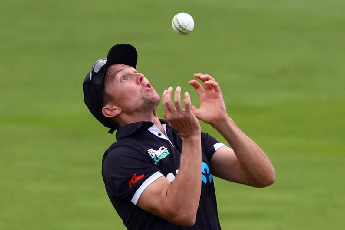 FILE PHOTO: Cricket - Fourth One Day International - England v New Zealand - Lord's Cricket Ground, London, Britain - September 15, 2023 New Zealand's Trent Boult takes a catch to dismiss England's Moeen Ali off the bowling of Rachin Ravindra Action Images via Reuters/Matthew Childs/File Photo