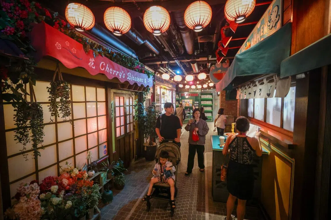 Guests at indoor arcade zone San Fransokyo Street, which is inspired by Big Hero 6.
