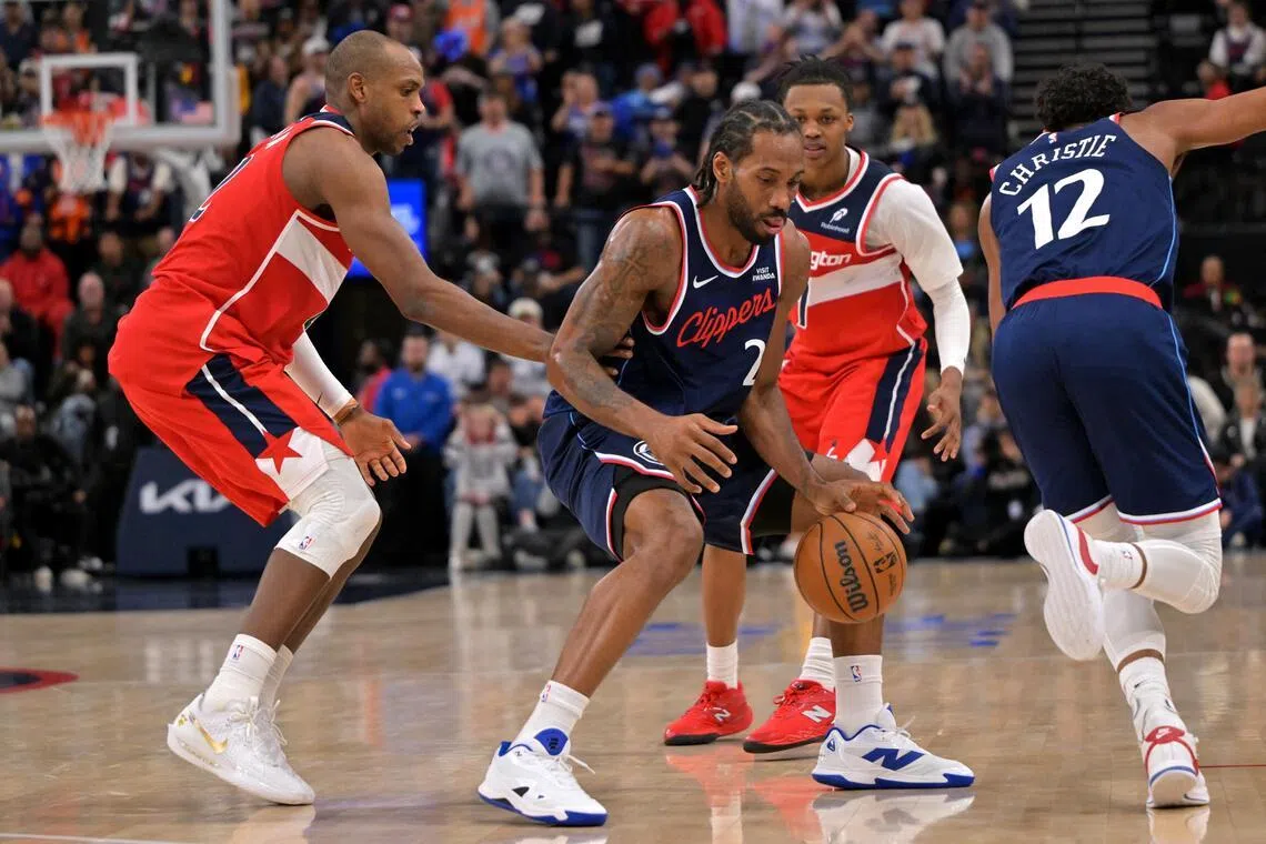 Los Angeles Clippers forward Kawhi Leonard steals the ball from Washington Wizards forward Khris Middleton in the second half at Intuit Dome. 