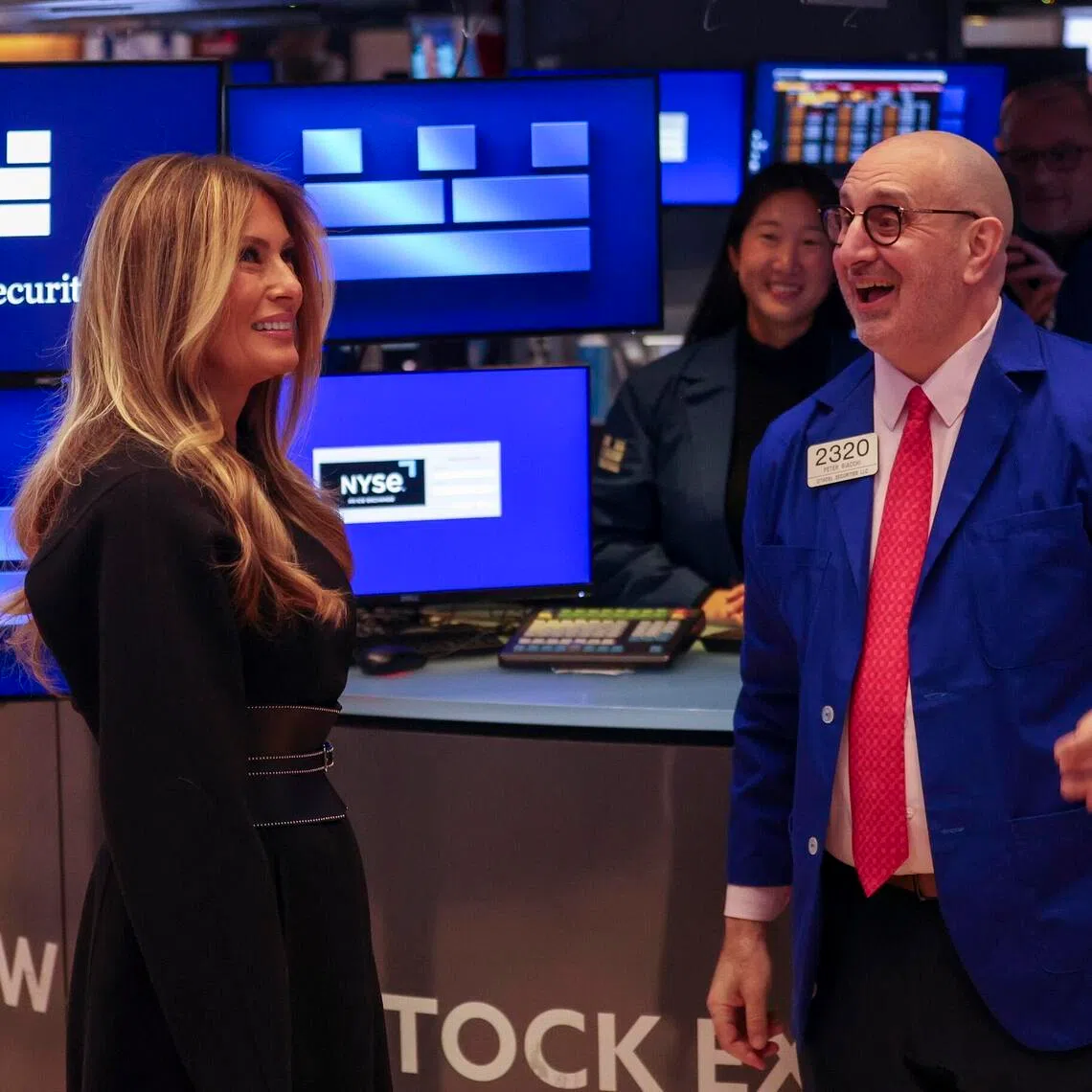 First Lady of the United States Melania Trump (left) speaking to traders at the New York Stock Exchange on Jan 28, before ringing the opening bell.