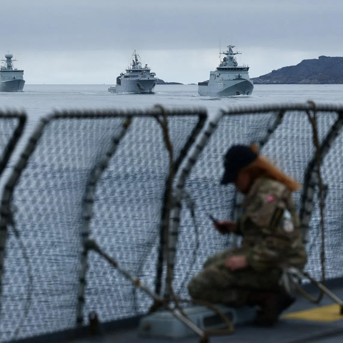 FILE PHOTO: Danish Navy vessels sail near the frigate Niels Juel as Danish and French armed forces perform military drills off the coast of Nuuk, Greenland, September 15, 2025. REUTERS/Guglielmo Mangiapane/File Photo