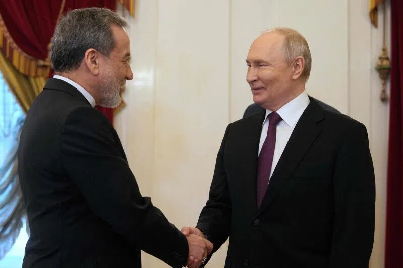 Russian President Vladimir Putin (right) and Iranian Foreign Minister Abbas Araghchi at the Boris Yeltsin Presidential Library in Saint Petersburg on April 27.
