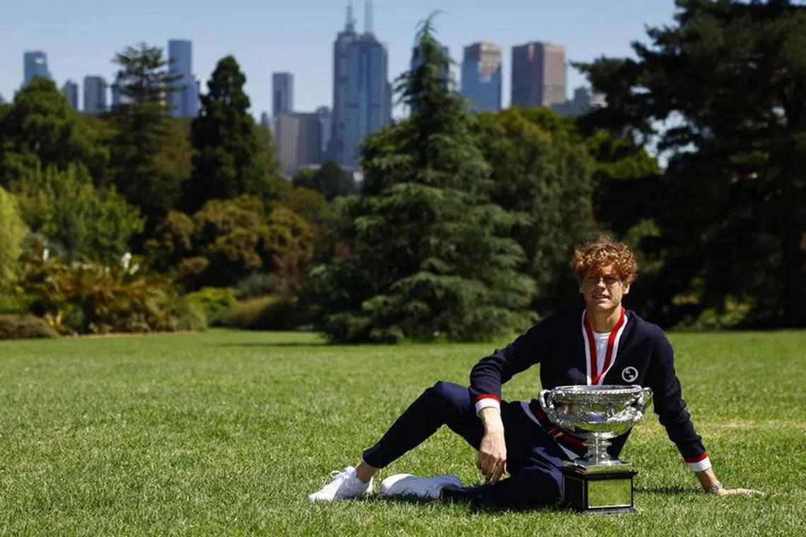 Tennis - Australian Open - Men's Singles Winner Photo Shoot - Royal Botanic Gardens Victoria, Melbourne, Australia - January 29, 2024 Italy's Jannik Sinner poses with the Australian Open trophy REUTERS/Issei Kato