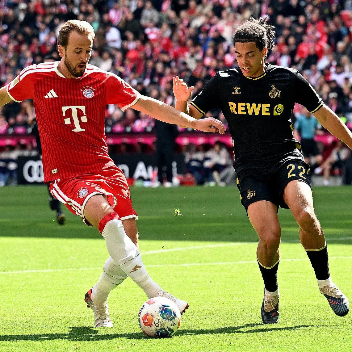 Soccer Football - Bundesliga - Bayern Munich v FC Cologne - Allianz Arena, Munich, Germany - May 16, 2026 Bayern Munich's Harry Kane in action with FC Cologne's Jahmai Simpson-Pusey REUTERS/Angelika Warmuth