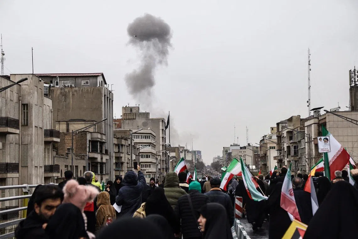 Smoke rising in Tehran after an air strike on March 13 during a rally to mark Quds Day, the last Friday of Ramadan.