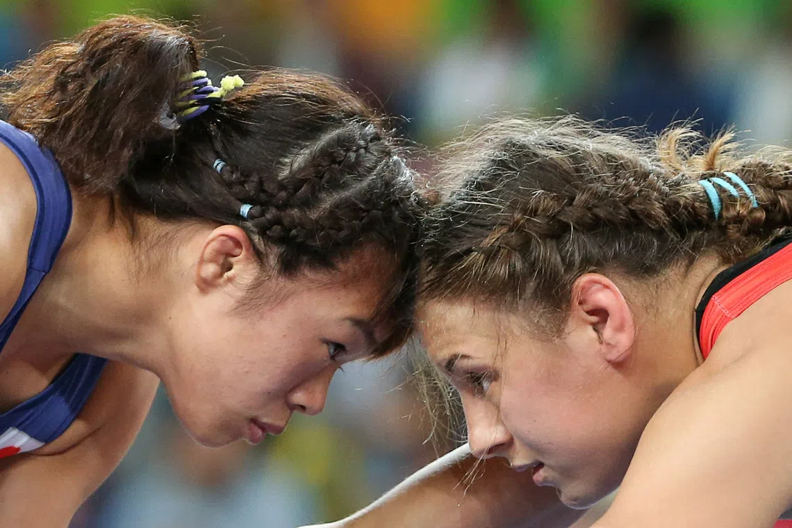 FILE PHOTO: 2016 Rio Olympics - Wrestling - Final - Women's Freestyle 63 kg Gold Medal - Carioca Arena 2 - Rio de Janeiro, Brazil - 18/08/2016. Maria Mamashuk (BLR) of Belarus and Risako Kawai (JPN) of Japan compete. REUTERS/Toru Hanai/File Photo