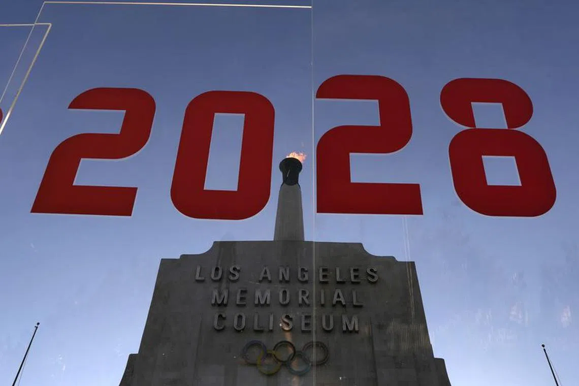 FILE PHOTO: An LA2028 sign is seen at the Los Angeles Coliseum to celebrate Los Angeles being awarded the 2028 Olympic Games, in Los Angeles, California, U.S., September 13, 2017. REUTERS/Lucy Nicholson/File Photo