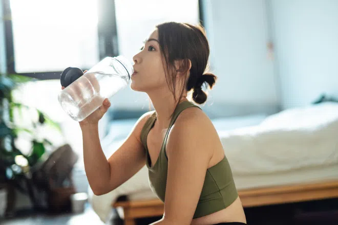 Woman drinking water from a bottle
