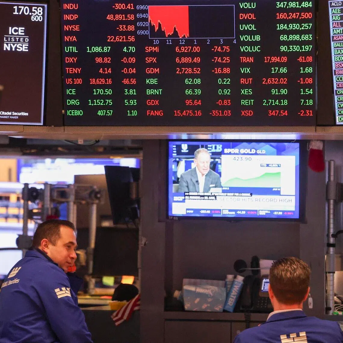 Traders working on the floor of the New York Stock Exchange in New York, on Jan 14, 2026. 