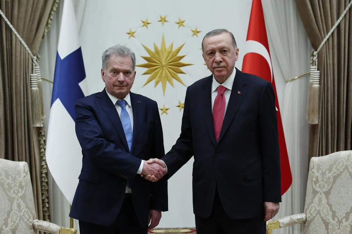 Finland's President Sauli Niinisto (left) and Turkish President Recep Tayyip Erdogan pose before their meeting at the presidential palace in Ankara, on March 17, 2023.