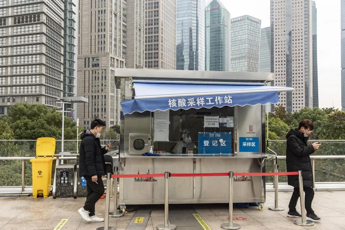 A Covid-19 testing booth in Shanghai, China, on Thursday, Dec. 8, 2022. China’s abrupt ending of its Covid Zero restrictions have forced economists to make sharp revisions to their growth projections for this year and next.