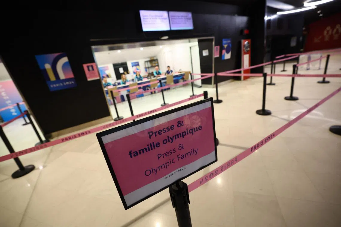 Signage for press accreditation centre is seen amid global IT outage disrupting the operations in Paris.