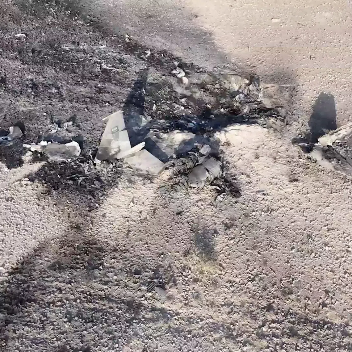 The wreckage of what the Houthi military media wing says is a downed Saudi jet, at a location given as Yemen.