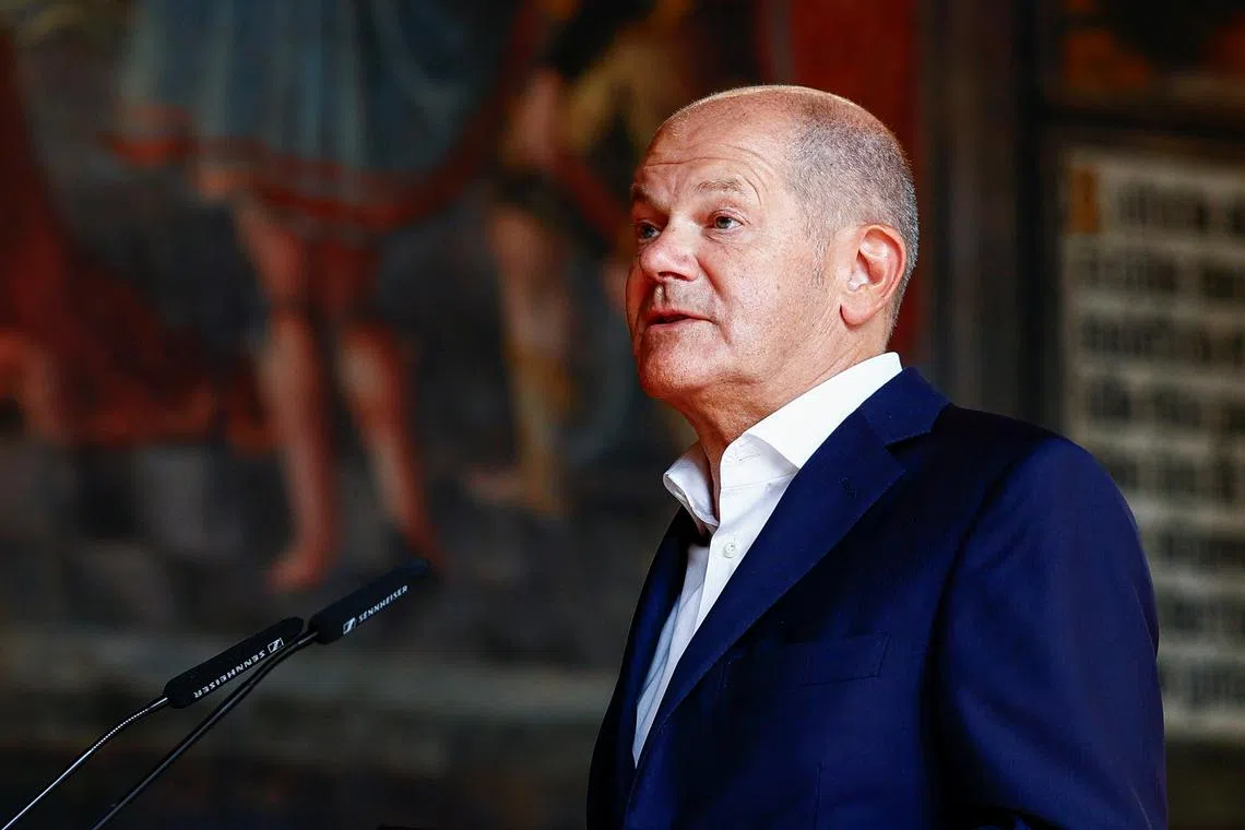 FILE PHOTO: German Chancellor Olaf Scholz attends a naturalisation ceremony, after his government shortened foreigners' paths to citizenship and ended a ban on dual nationality, in Bremen, Germany, August 19, 2024. REUTERS/Leon Kuegeler/File Photo