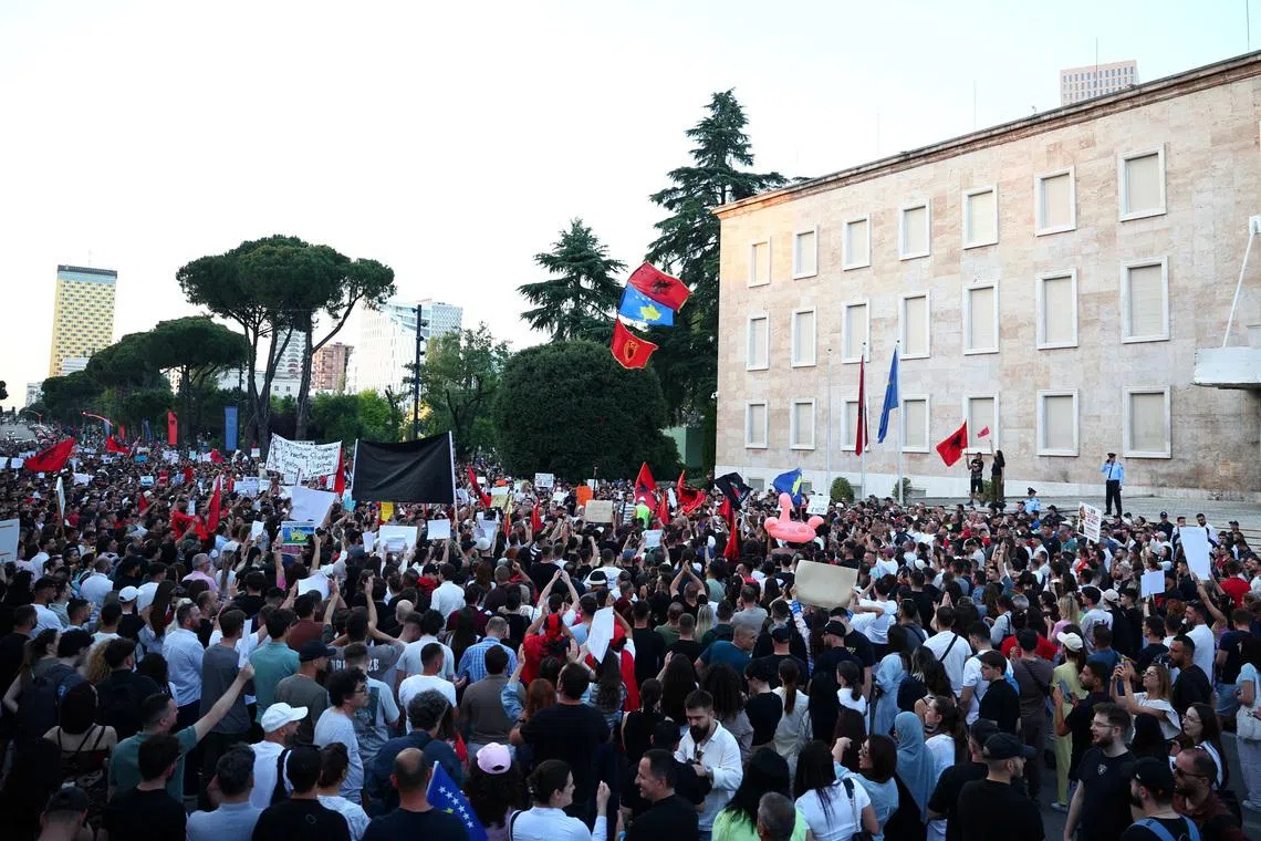 People protesting against a luxury resort plan by a company linked with Donald Trump’s son-in-law Jared Kushner in a protected area, in Tirana, Albania, on June 2.