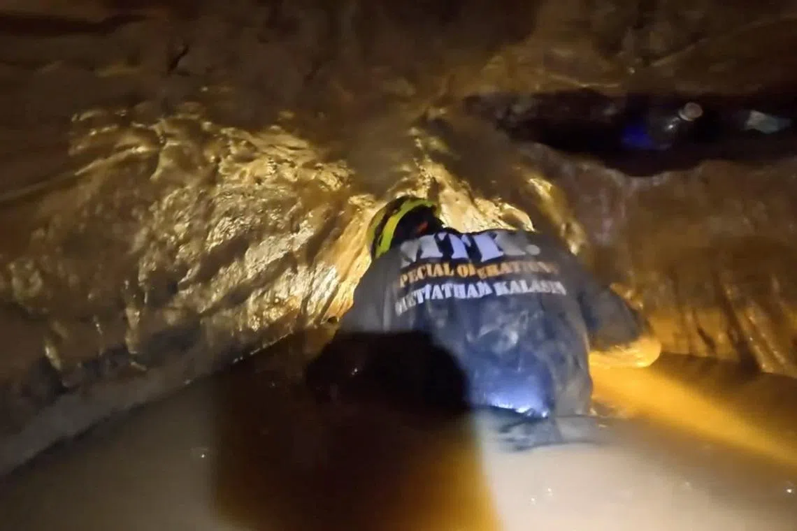 Rescue teams find five trapped in Laos cave, search for two more continues