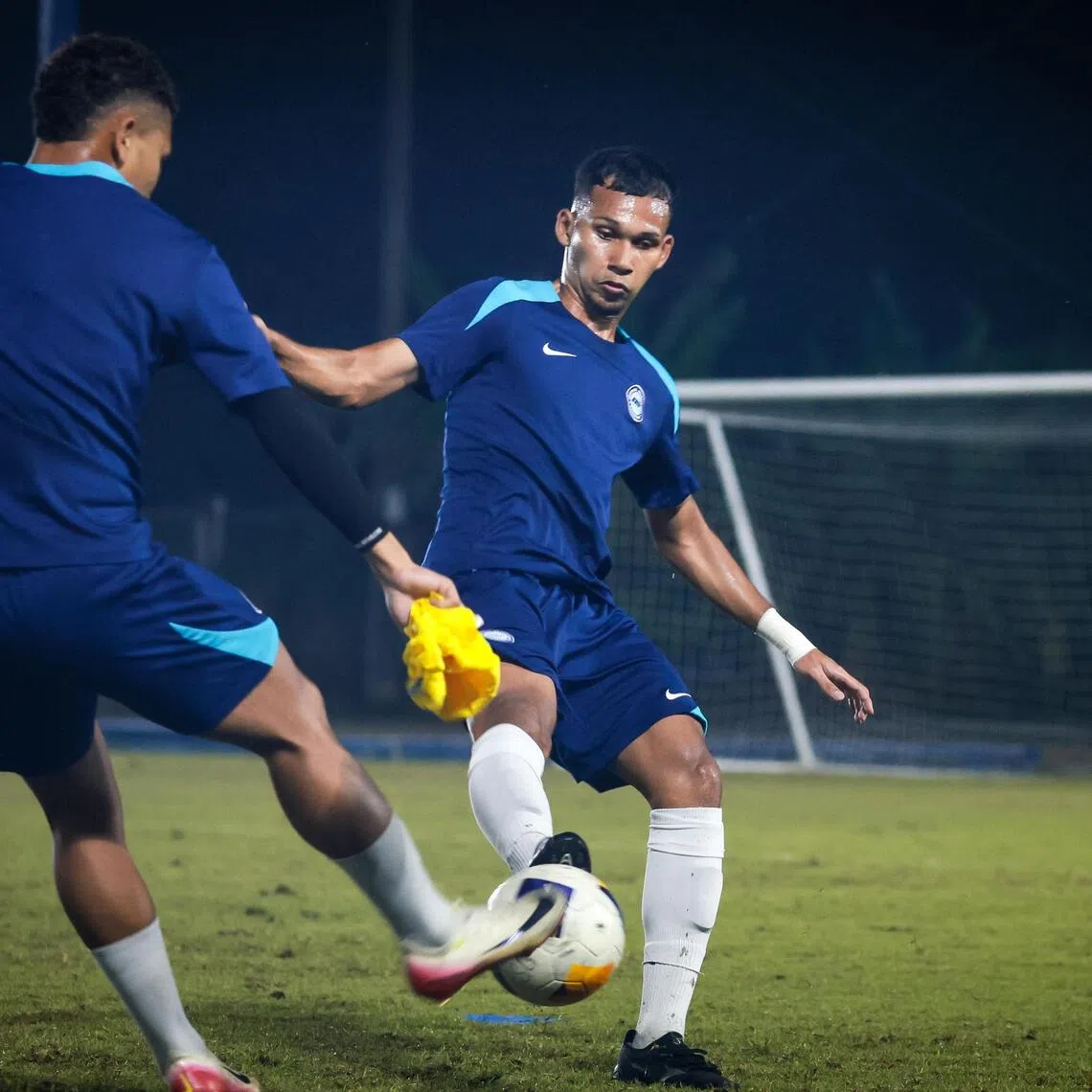Singapore Under-22s forward Khairin Nadim putting his best foot forward during a training session at Romsai Football Club in Bangkok on Dec 5.