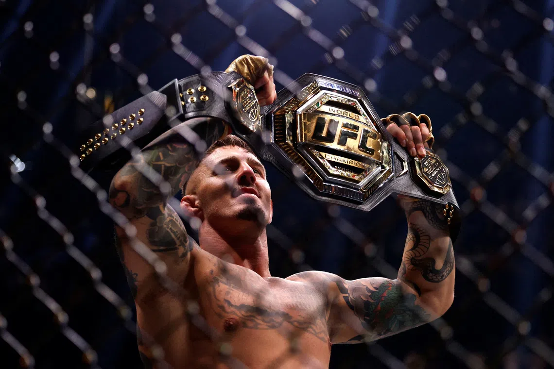 FILE PHOTO: Mixed Martial Arts - UFC 304 - Manchester - Co-op Live, Manchester, Britain - July 28, 2024. Tom Aspinall celebrates after winning his fight against Curtis Blaydes. REUTERS/John Sibley/File Photo