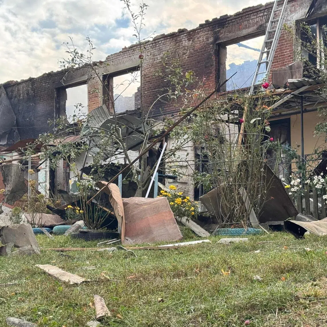 A damaged residential building following a Russian drone attack in Ukraine's Sumy region.