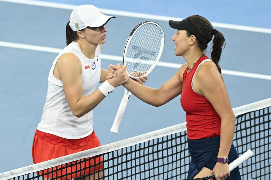 Iga Swiatek (left) crashed 6-2, 6-2 in a 71-minute defeat to Jessica Pegula in Sydney.
