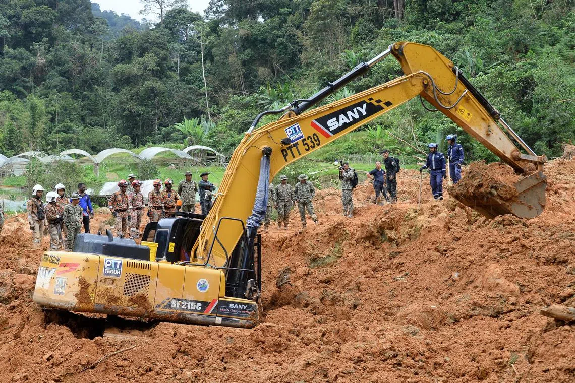 Search and Rescue personnel searching for more victims at the Father's Organic Farm in Batang Kali on Dec 18, 2022. 