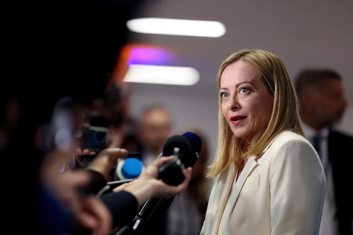 Italian Prime Minister Giorgia Meloni speaks to the media at a NATO summit in The Hague, Netherlands June 25, 2025. REUTERS/Claudia Greco