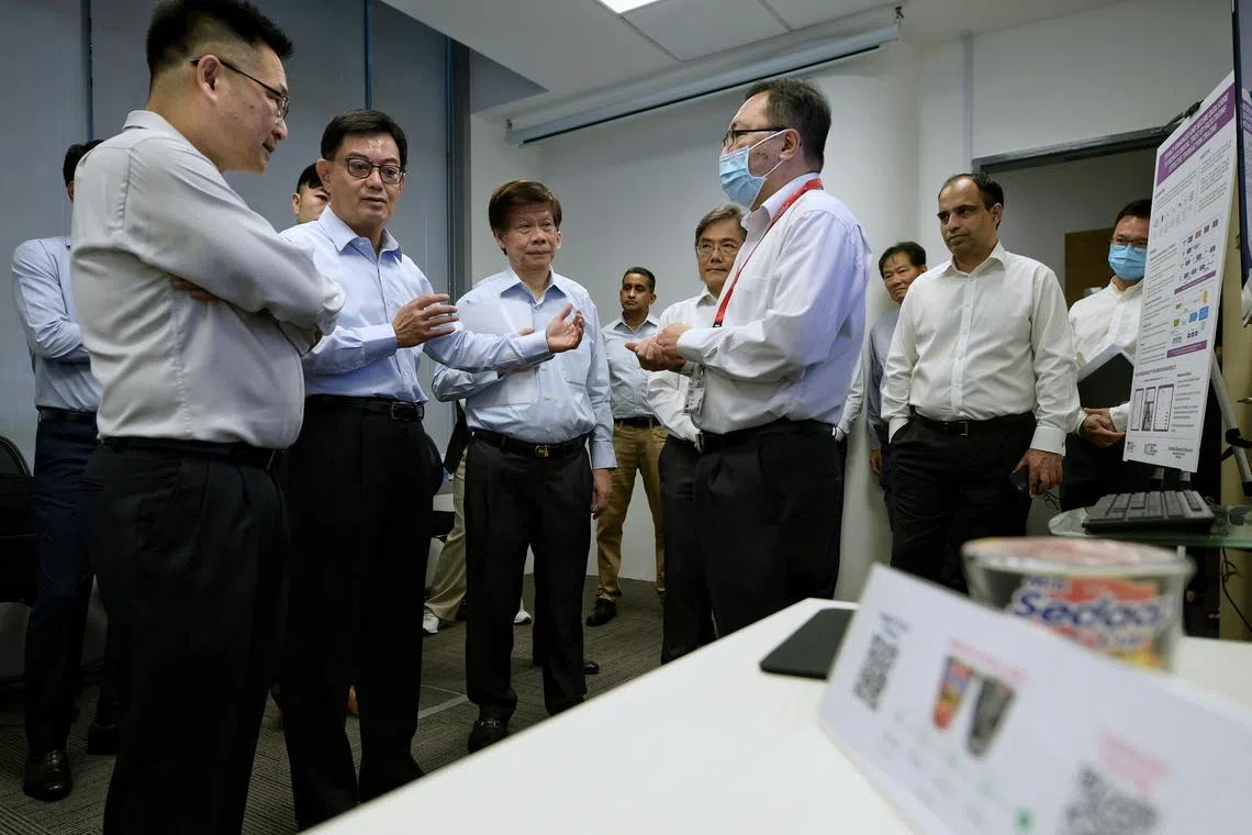 DPM Heng Swee Keat on a tour of NTU's Strategic Centre for Research in Privacy-Preserving Technologies & Systems, on Nov 10, 2022.