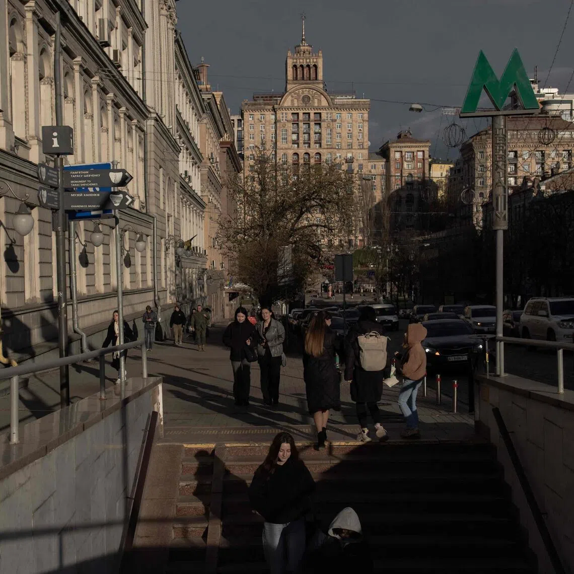 People walk on a street in downtown Kyiv, on April 6, 2026, amid the Russian invasion of Ukraine.