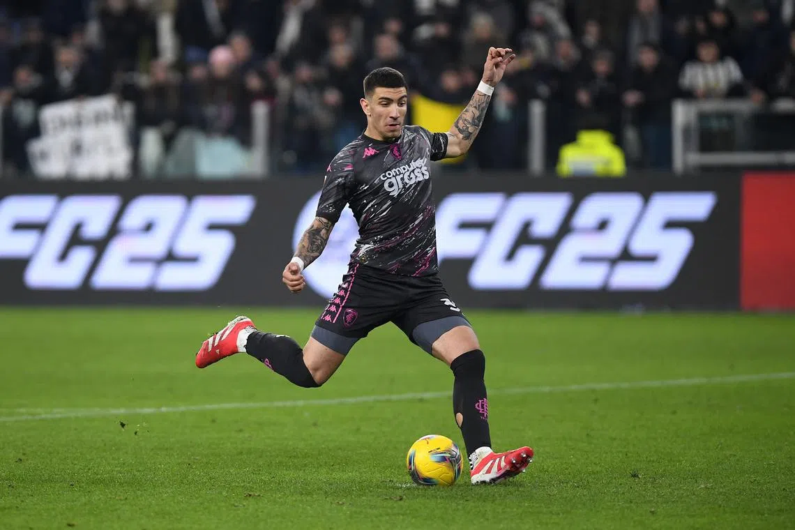 FILE PHOTO: Soccer Football - Coppa Italia - Quarter Final - Juventus v Empoli - Allianz Stadium, Turin, Italy - February 26, 2025 Empoli's Luca Marianucci scores the winning penalty during the penalty shootout REUTERS/Massimo Pinca/File Photo