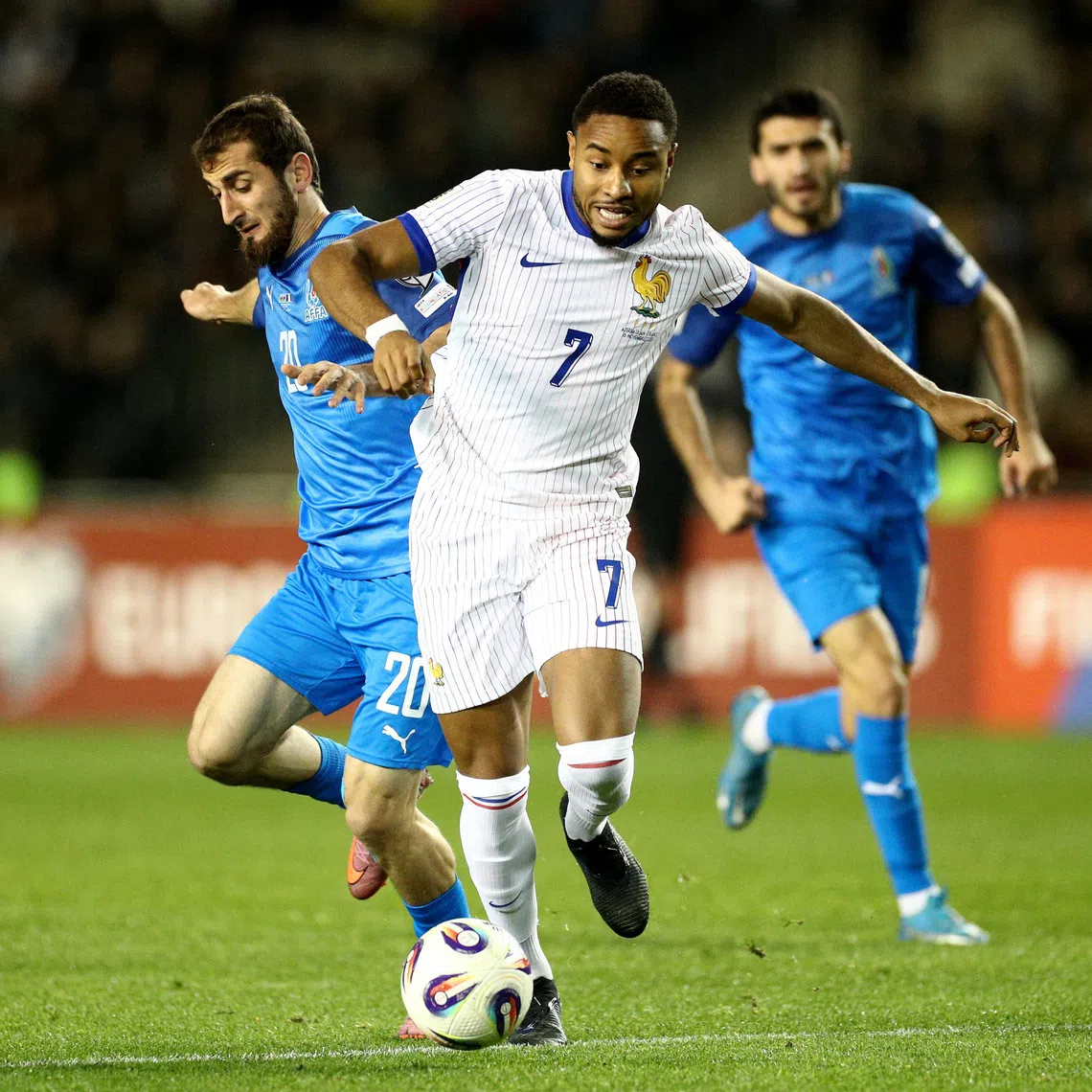 Soccer Football - World Cup - UEFA Qualifiers - Group D - Azerbaijan v France - Tofiq Bahramov Republican Stadium, Baku, Azerbaijan - November 16, 2025 Azerbaijan's Abdulakh Khaybulaev in action with France's Christopher Nkunku REUTERS/Aziz Karimov